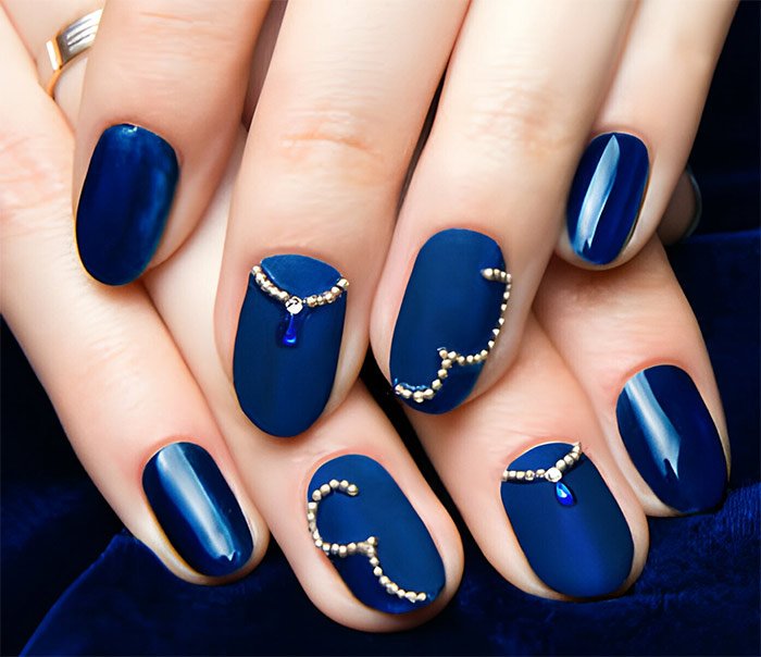 Navy blue nails with embelishment